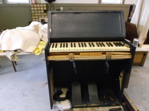 Not ready for inspection! Military chaplain's portable reed organ, World War II-era; Currently undergoing restoration in the Workshop.