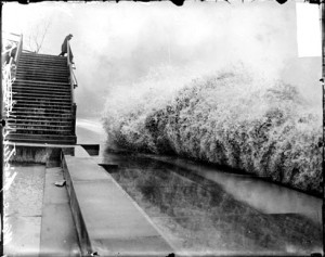 Wave breaking on the shore of Lake Michigan by Lincoln Park while a man watches from High Bridge Chicago Daily News, Inc., photographer. Published 1913 Nov. 10. Photo courtesy of Library of Congress, American Memory project.