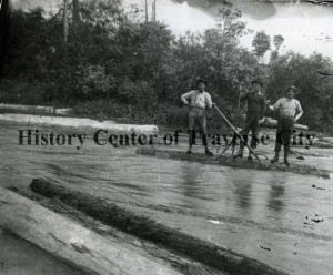 Men at Betsie River, working with peavys to ensure logs are driven downriver. Image courtesy of the Bensley Collection, History Center of Traverse City.