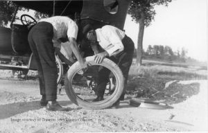 An example of what it took to change out a tire, when poor Robert's were punctured. Henry J. WItkop and Dave Youker changing the tire on Witkop's Napolean car, ca. 1920. Image courtesy of Bean Collection, 850.051007.87.